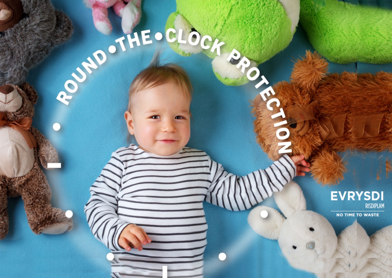 Evrysdi 'Round the clock protection' ad: a baby lying among plush toys, reaching toward a teddy bear